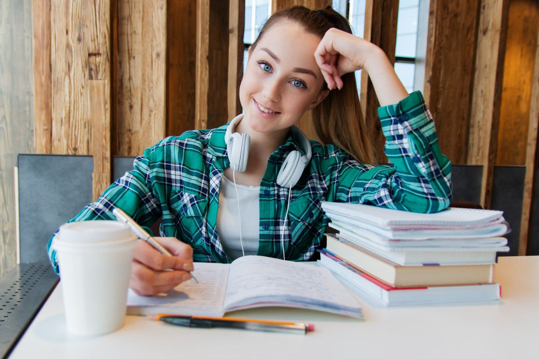 Teenage girl at her desk doing school work